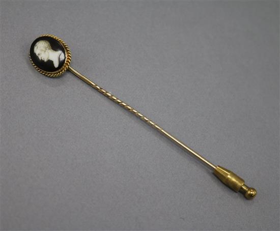 An early 20th century yellow metal and enamel miniature portrait stick pin, 88mm.